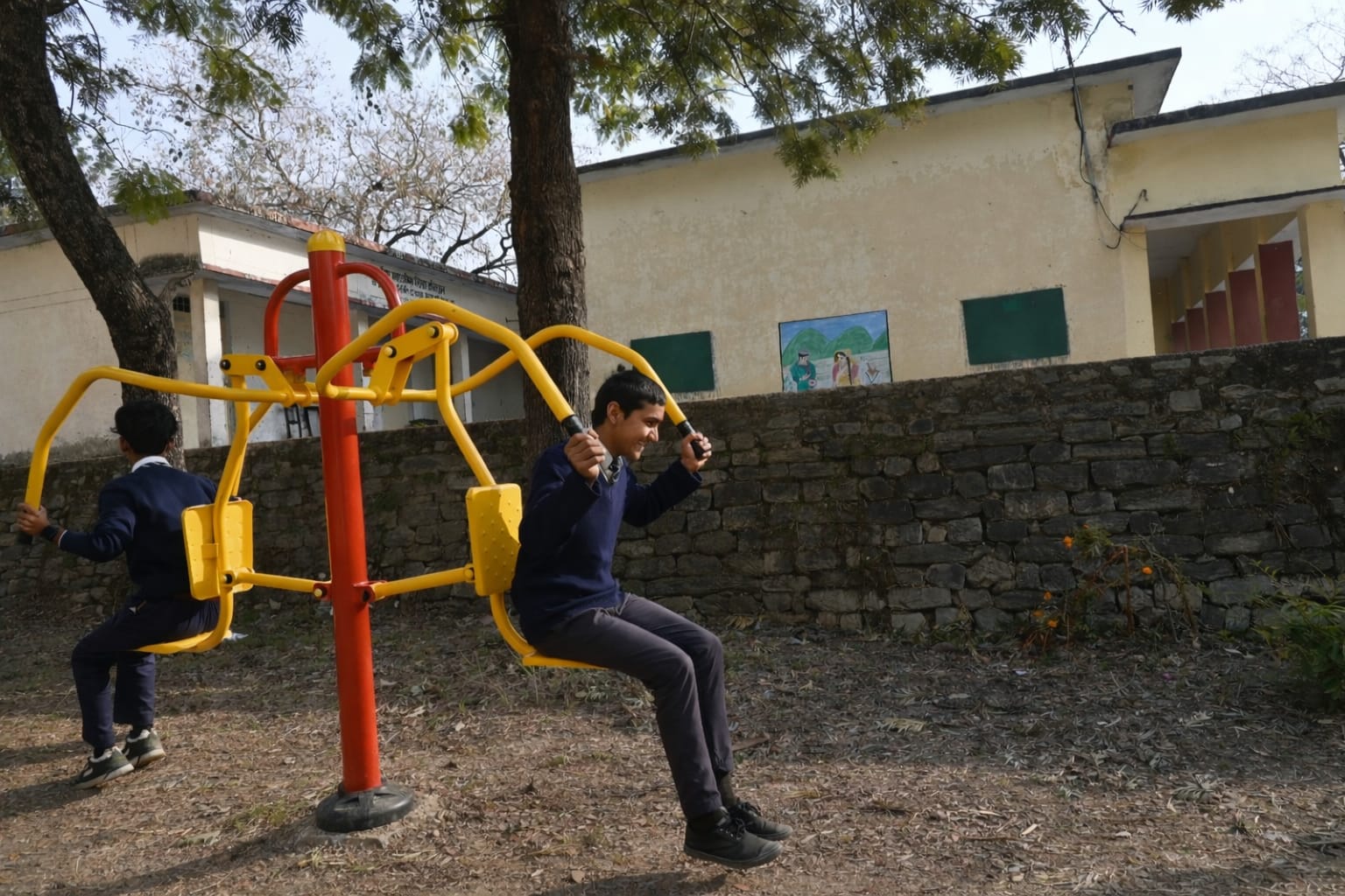 Outdoor fitness equipment installed on school campus lawn