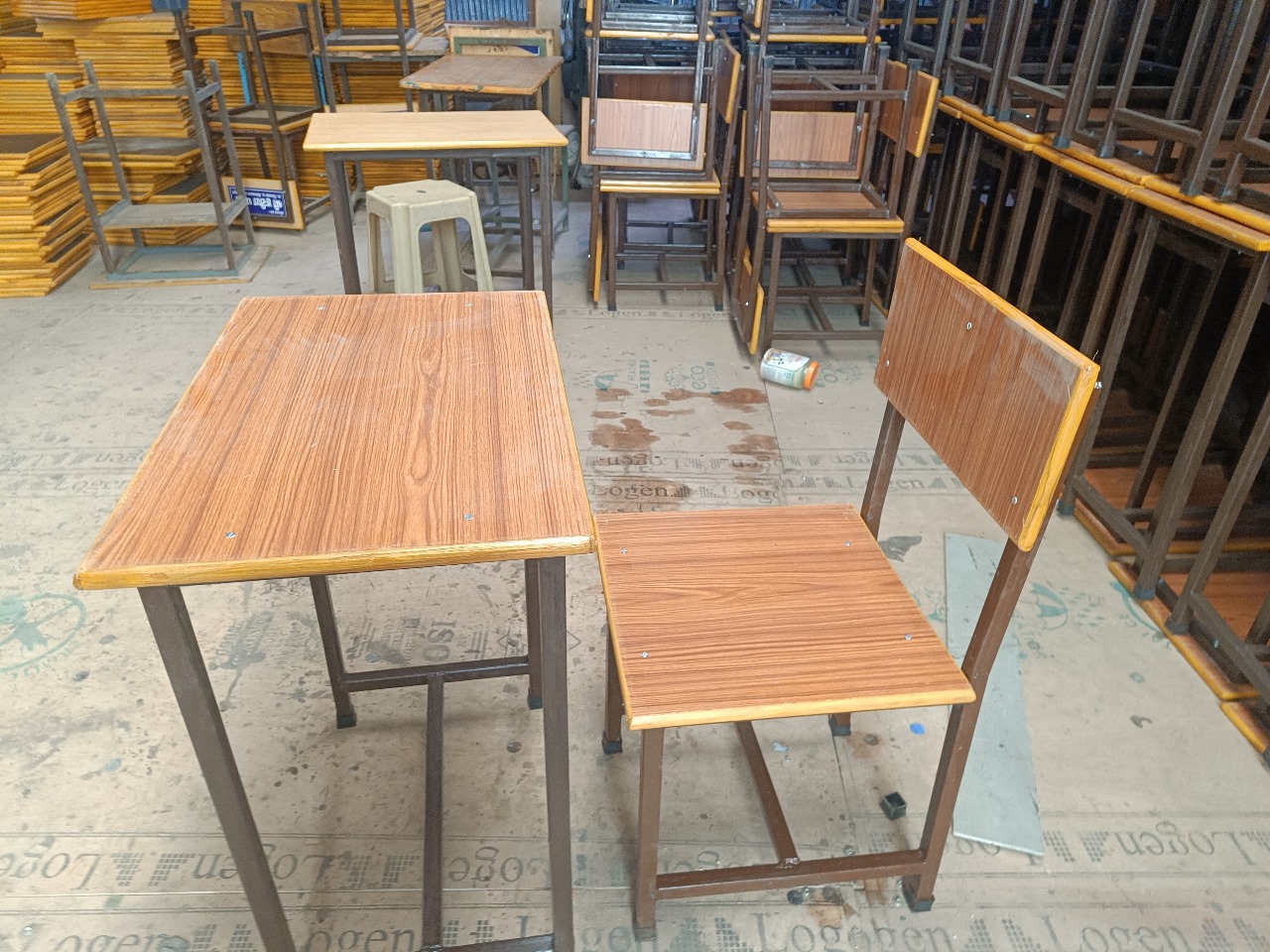 Welded tubular steel frames for student desks in fabrication workshop